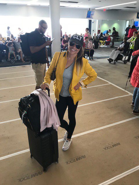 Girl wearing CLT hat in Charlotte airport