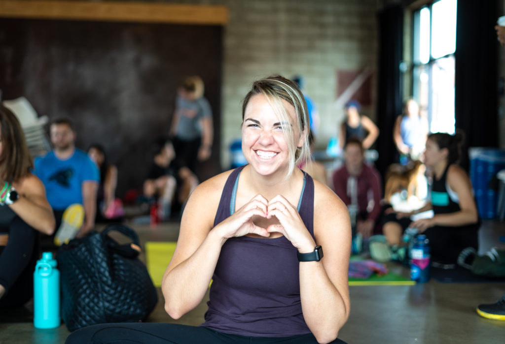 Girl heart with hands doing yoga in charlotte